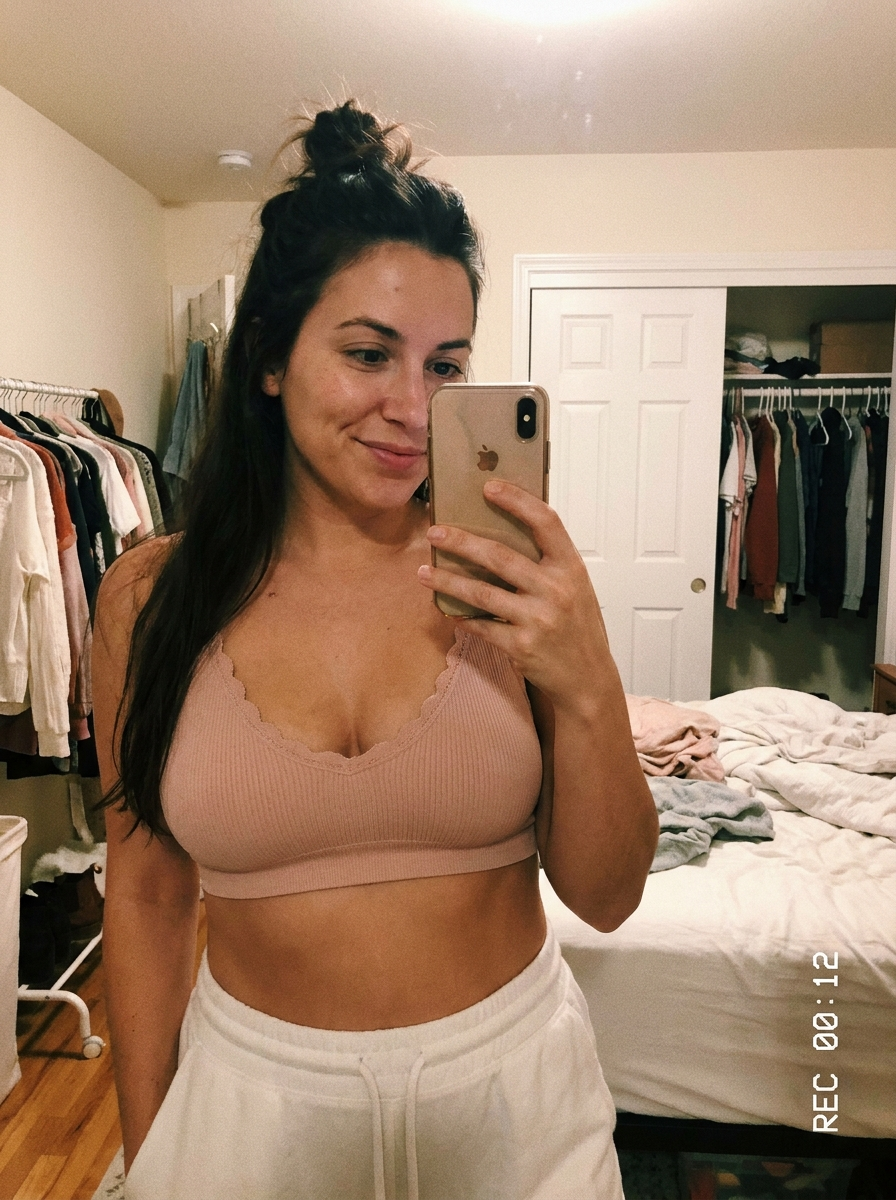 Mirror try-on photo of the Sonist Jelly Bra in blush